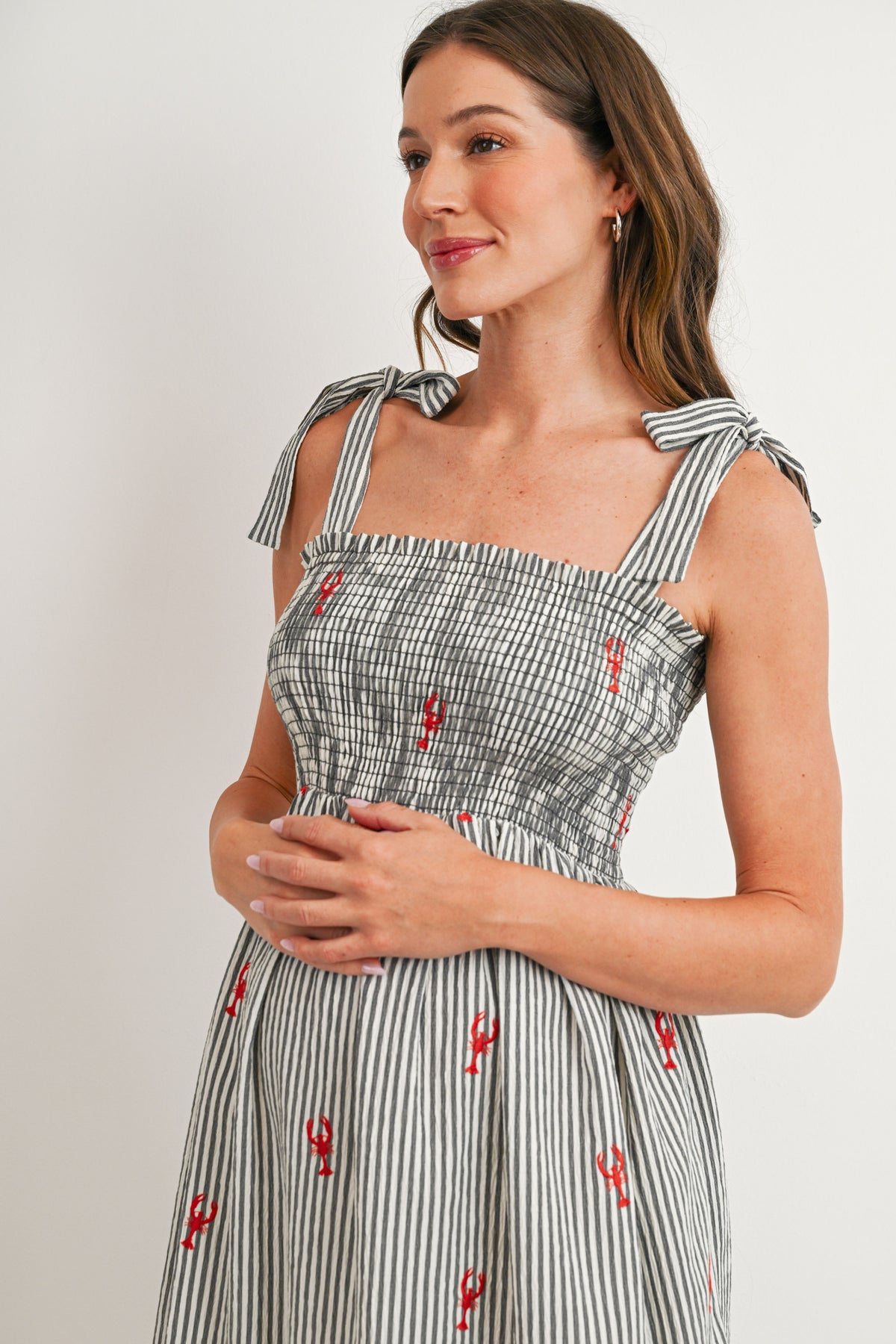 Black Striped maternity midi dress with stretchy smocked bodice – close-up detail