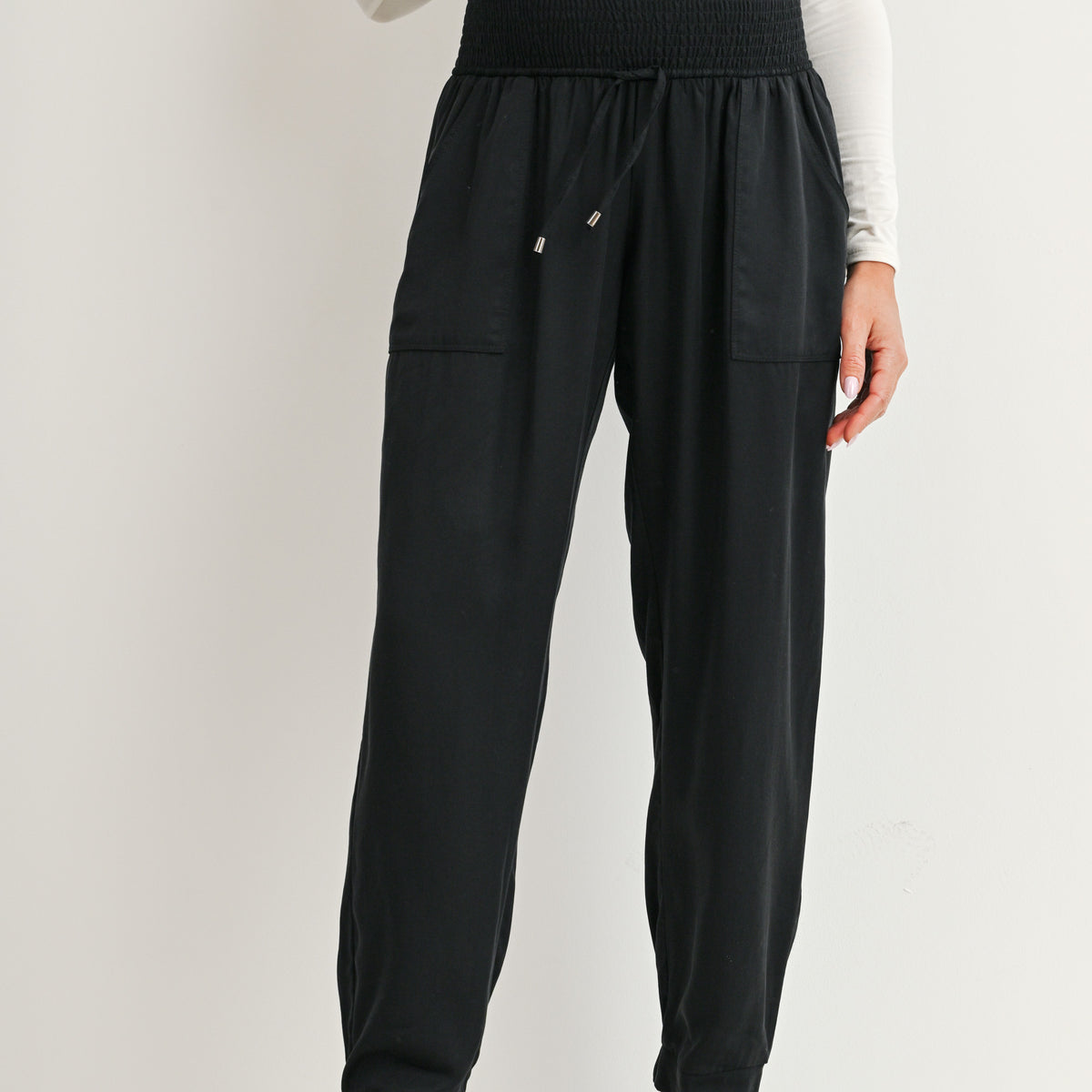 Black maternity jogger pants with smocked waistband and front pockets