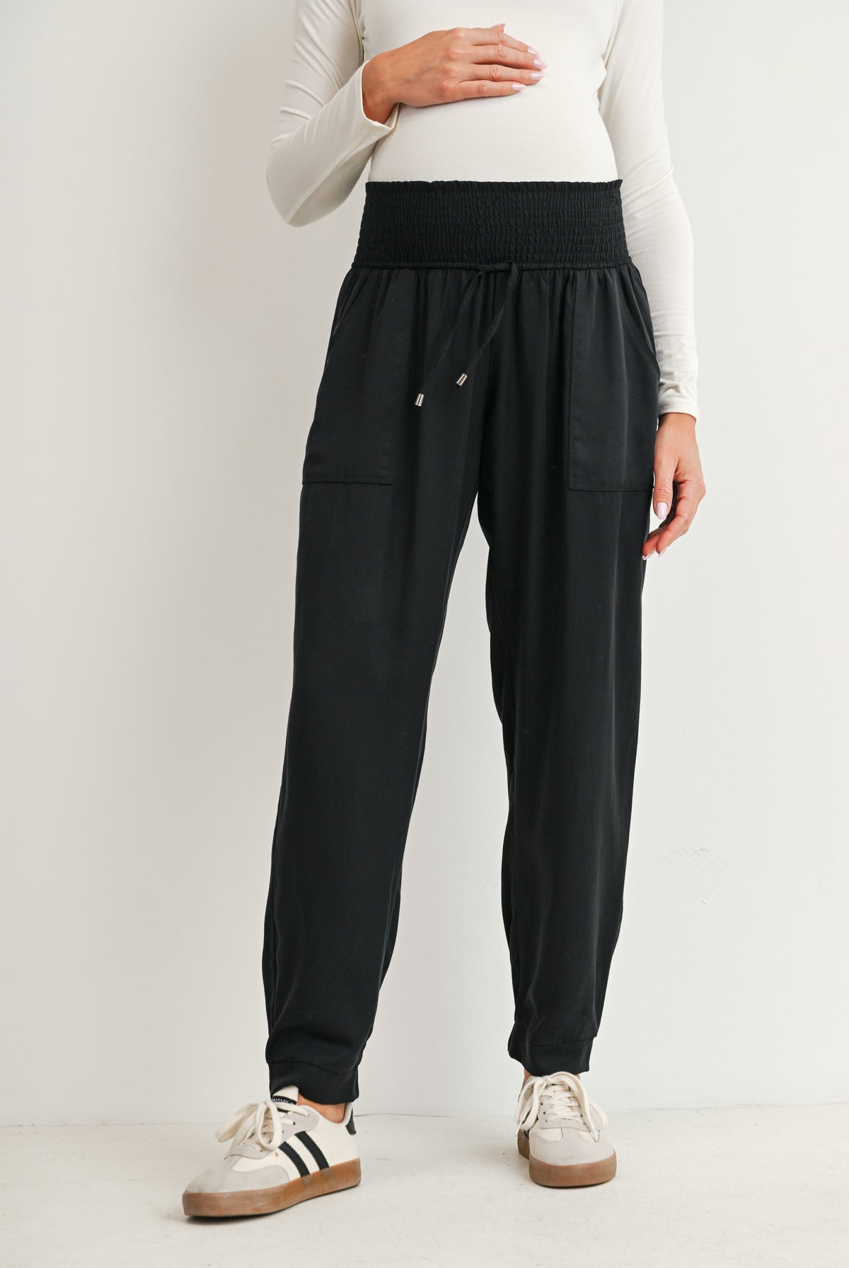 Black maternity jogger pants with smocked waistband and front pockets