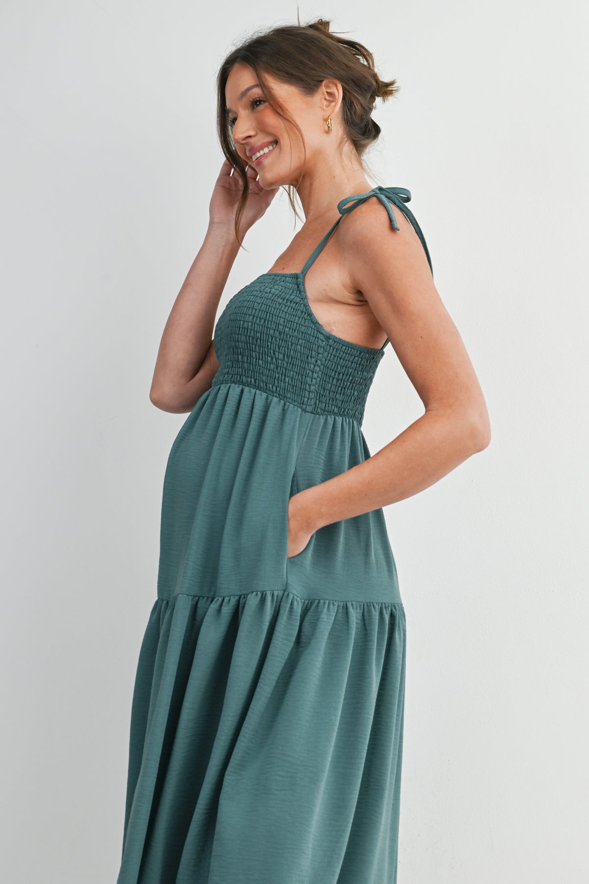 Green Smocked Empire Waist Maternity Midi Dress with Tie Straps & Pockets Close Up
