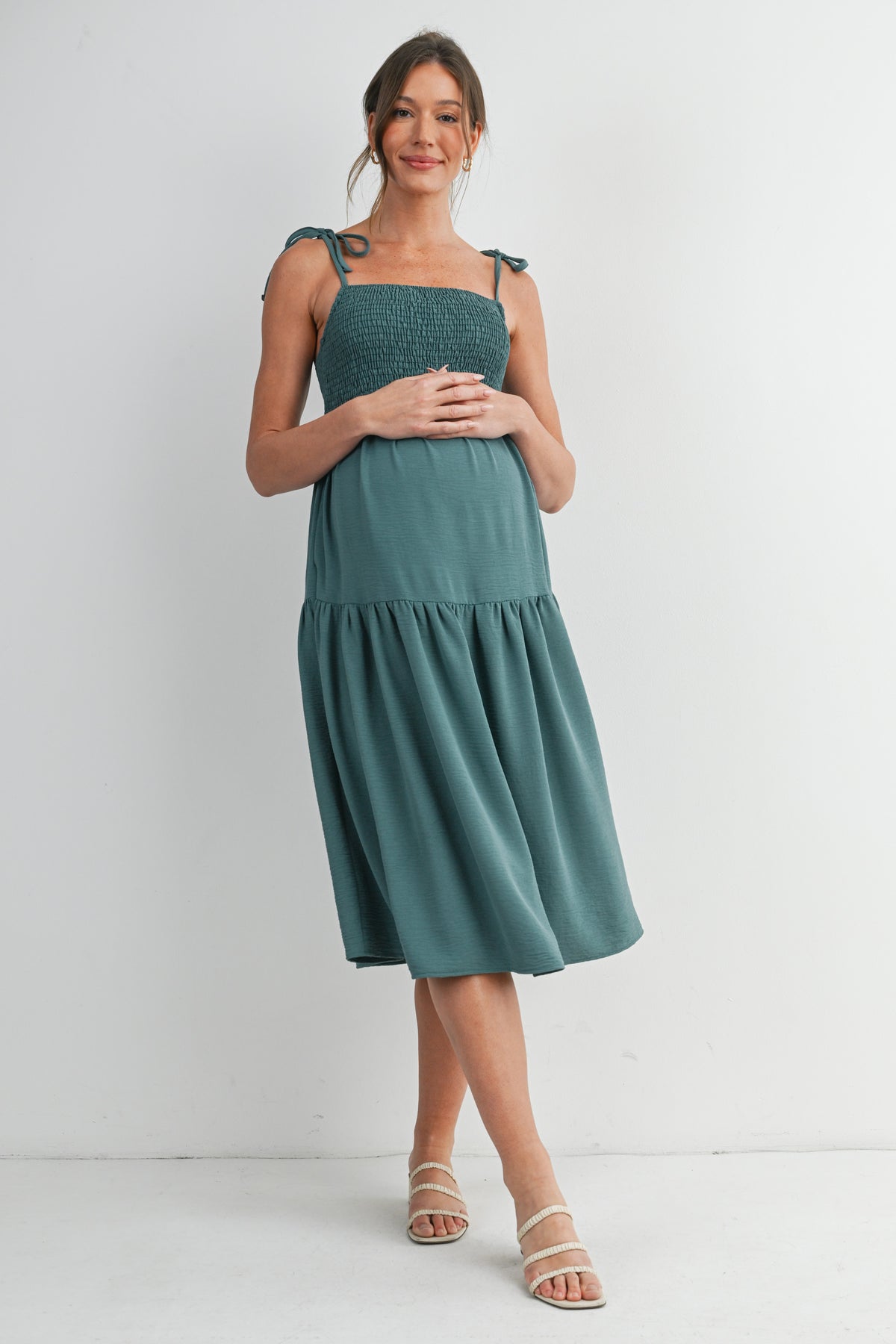 Green Smocked Empire Waist Maternity Midi Dress with Tie Straps & Pockets Front View
