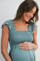 Sage Smocked Empire Waist Maternity Dress with Ruffle Hem Close Up Detail