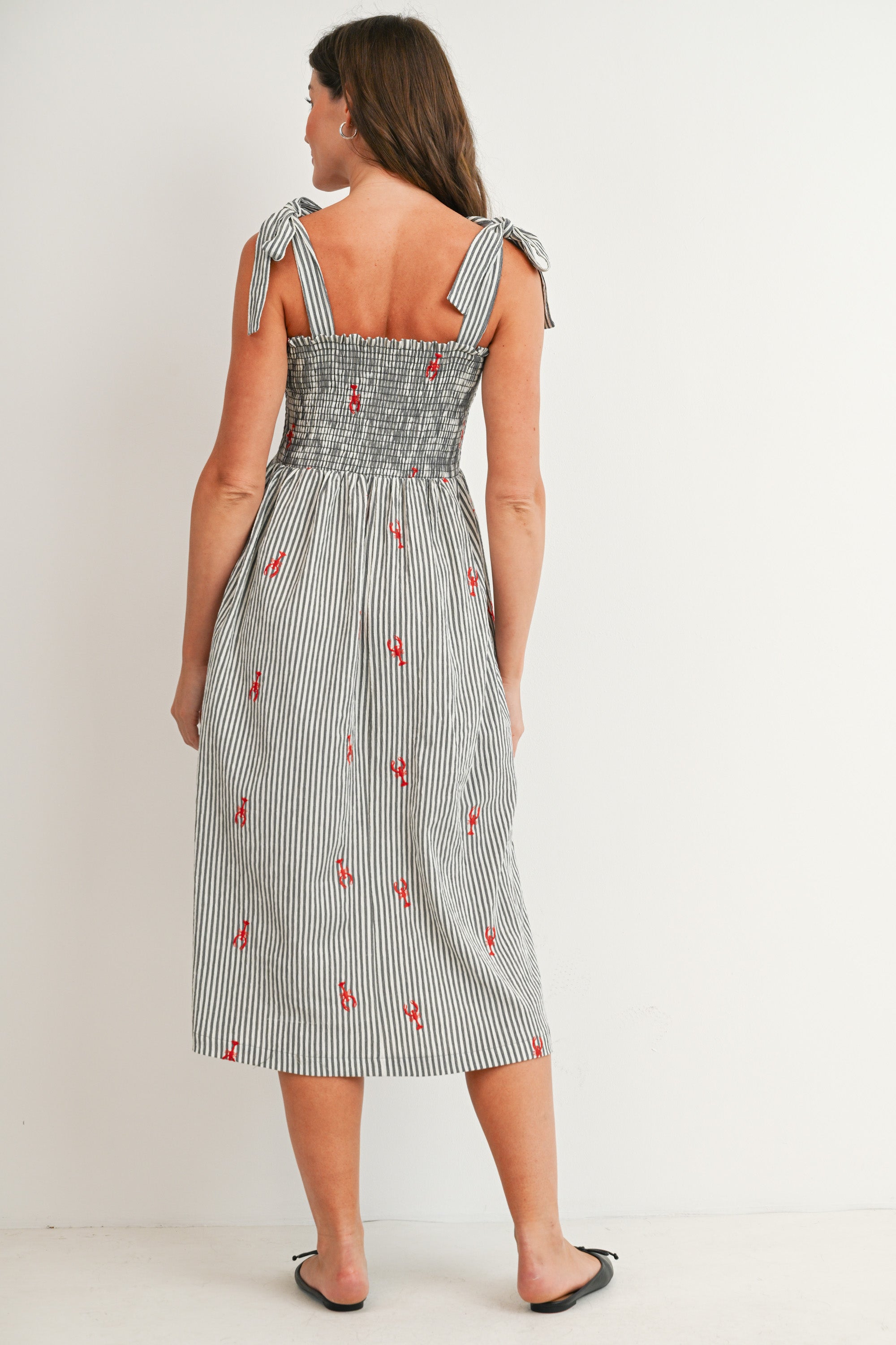 Black Striped smocked tie shoulder maternity midi dress with red lobster embroidery – back view