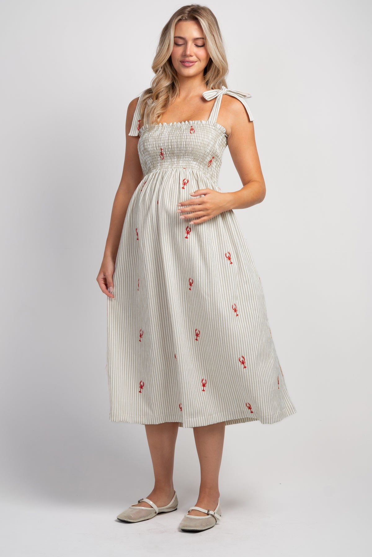 Taupe Striped smocked tie shoulder maternity midi dress with red lobster embroidery – front view