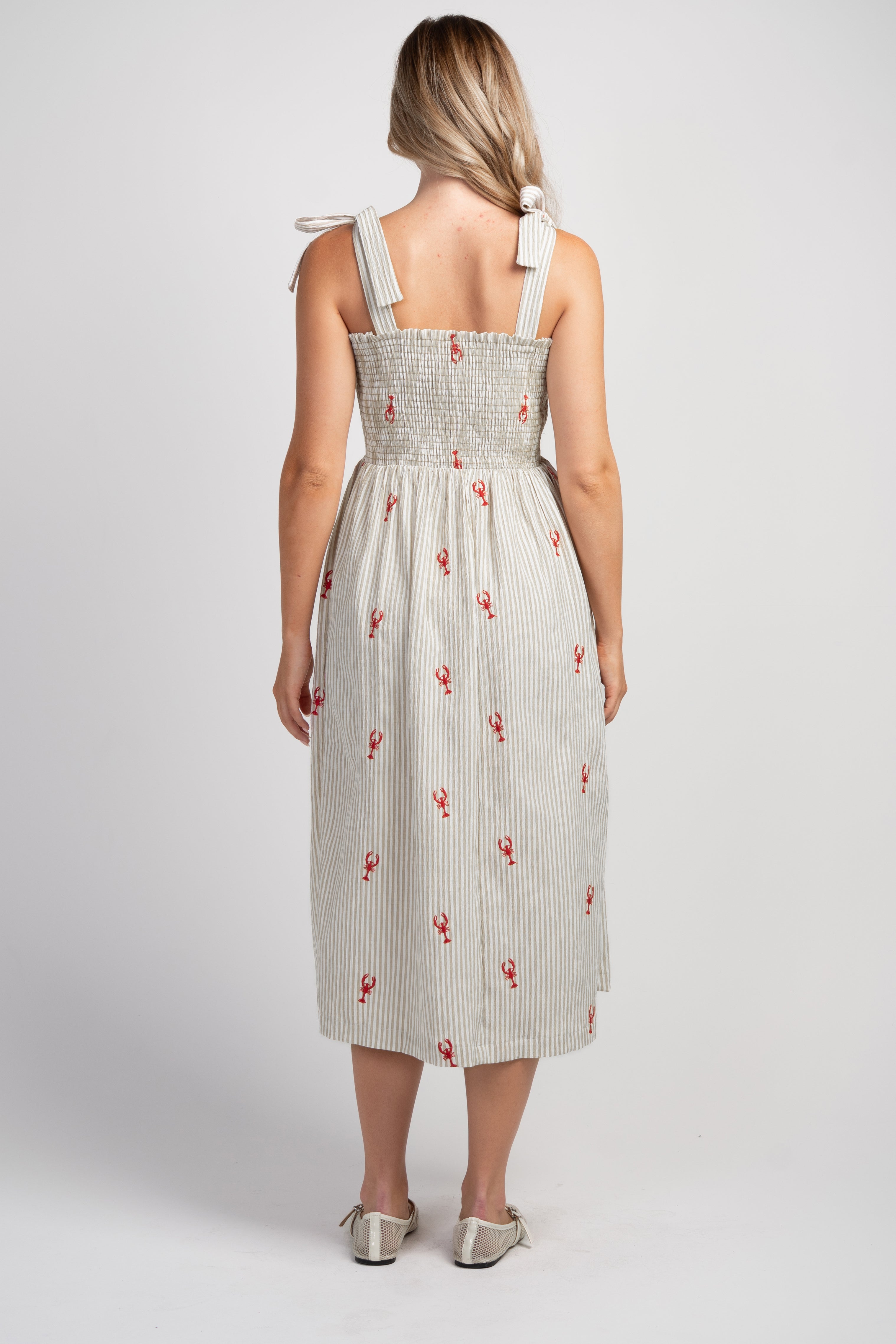 Taupe Striped smocked tie shoulder maternity midi dress with red lobster embroidery – back view