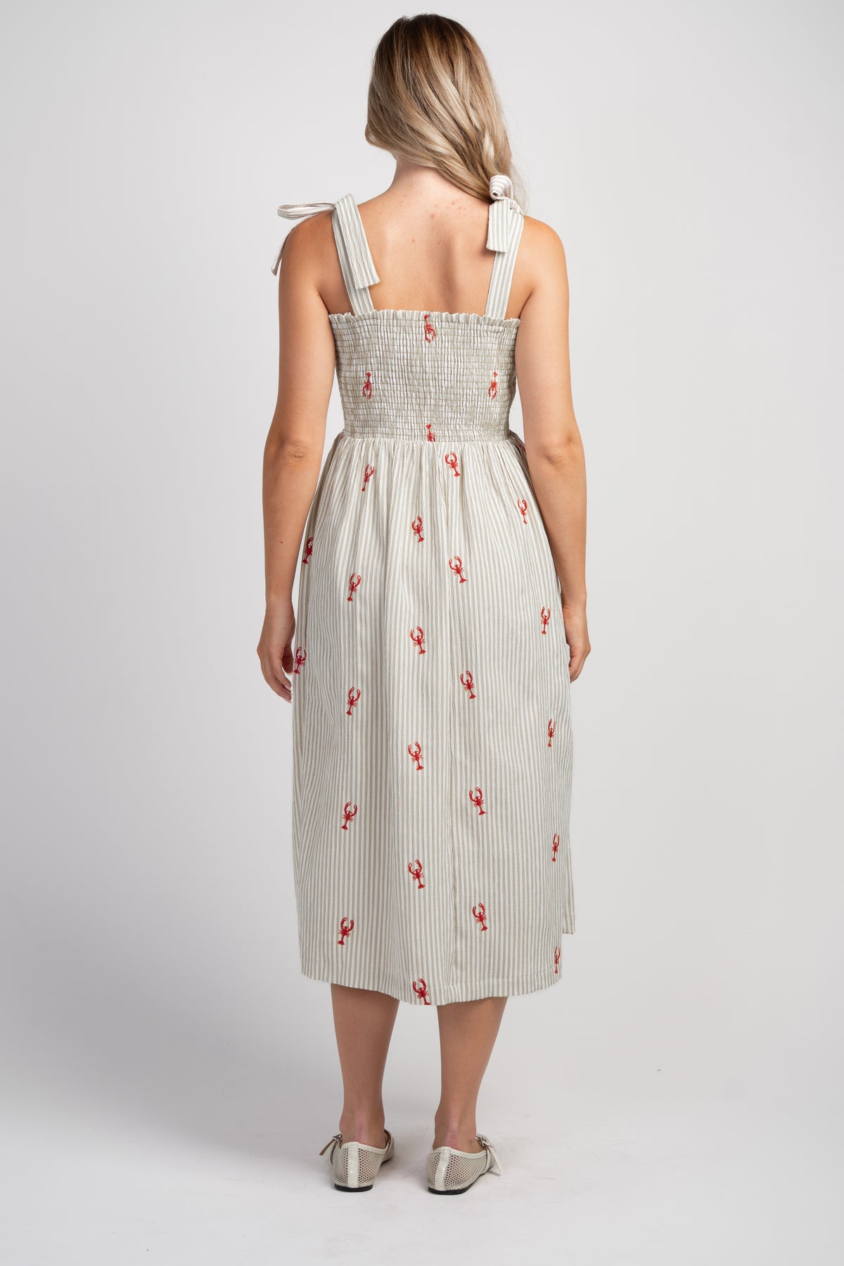 Taupe Striped smocked tie shoulder maternity midi dress with red lobster embroidery – back view