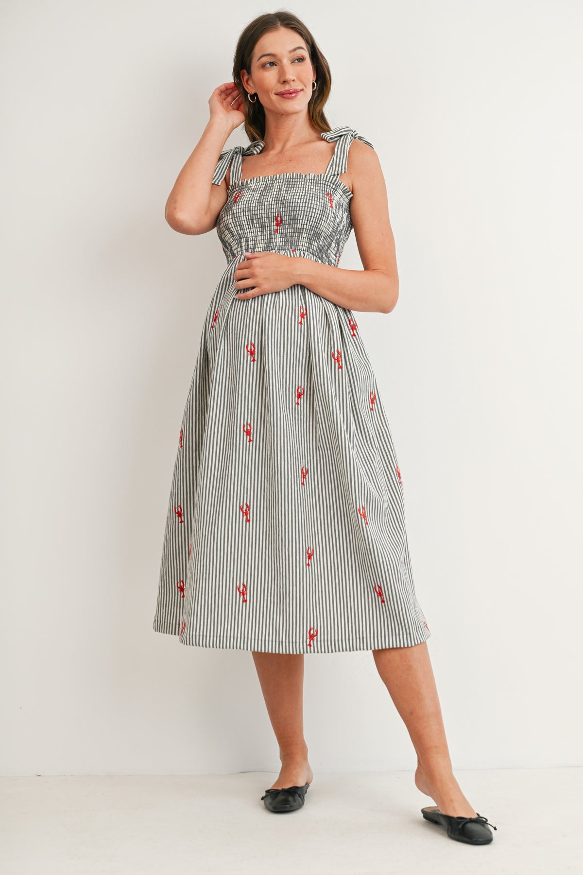 Black Striped smocked tie shoulder maternity midi dress with red lobster embroidery – front view