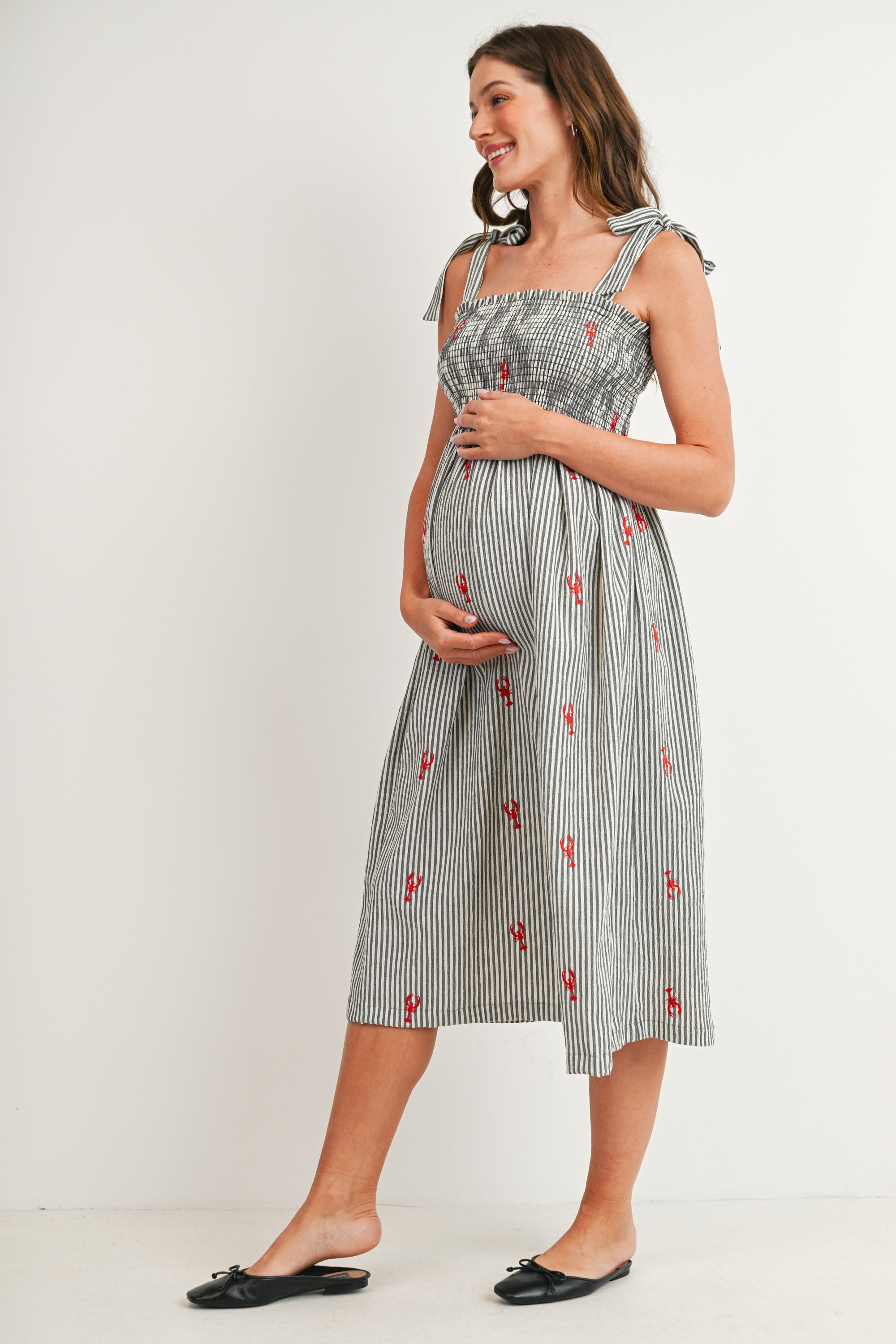 Black Striped smocked tie shoulder maternity midi dress with red lobster embroidery – side view