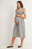 Black Striped smocked tie shoulder maternity midi dress with red lobster embroidery – side view