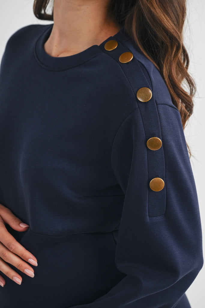 Navy Long Sleeve Crewneck Ruffle Hem Maternity Dress Button Detail Close Up