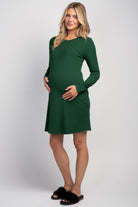 Ribbed long sleeve maternity nursing dress with snap front in green – full body view
