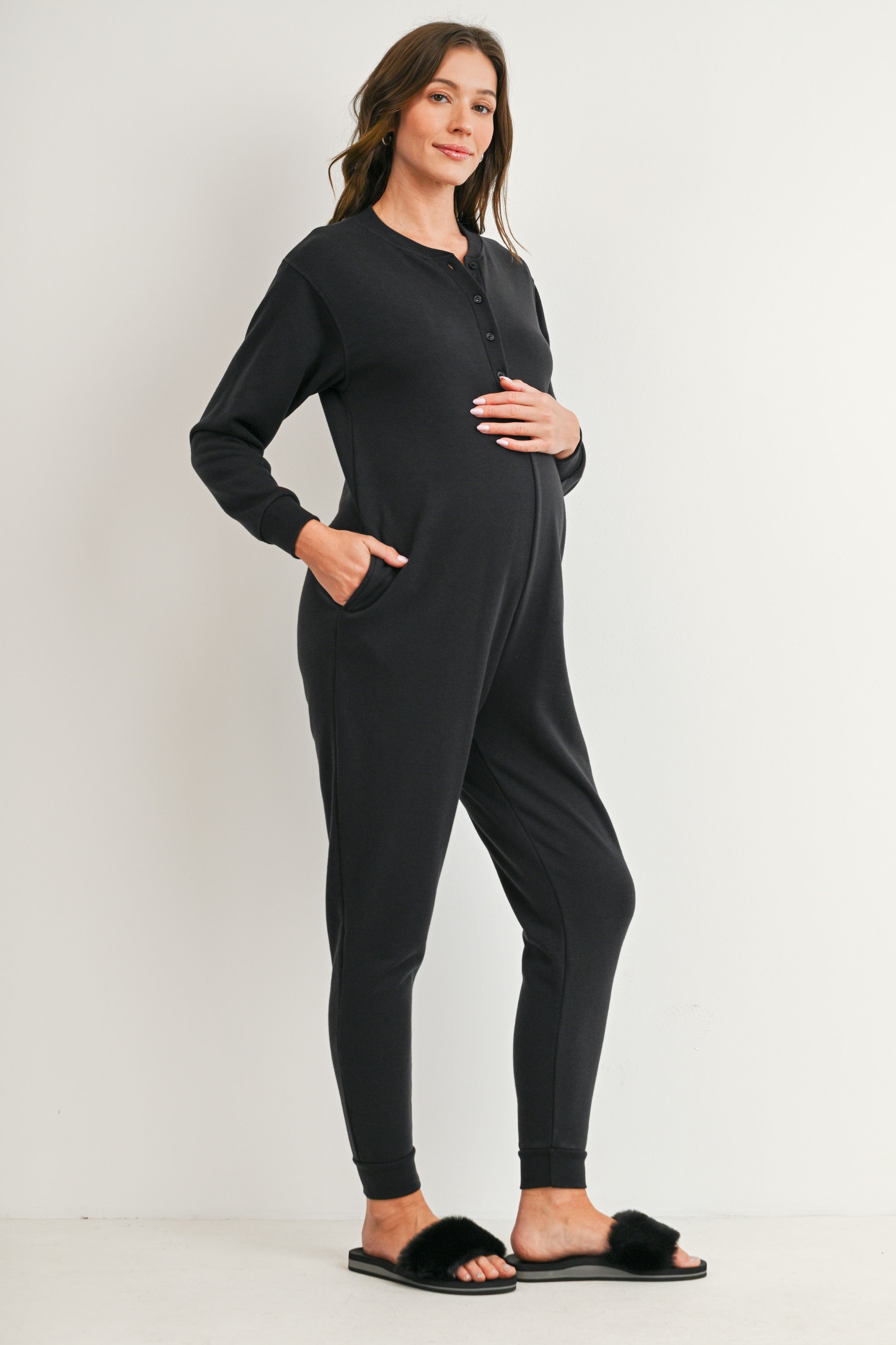 Black maternity nursing jogger jumpsuit with button-front access and pockets