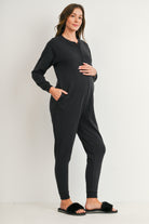 Black maternity nursing jogger jumpsuit with button-front access and pockets