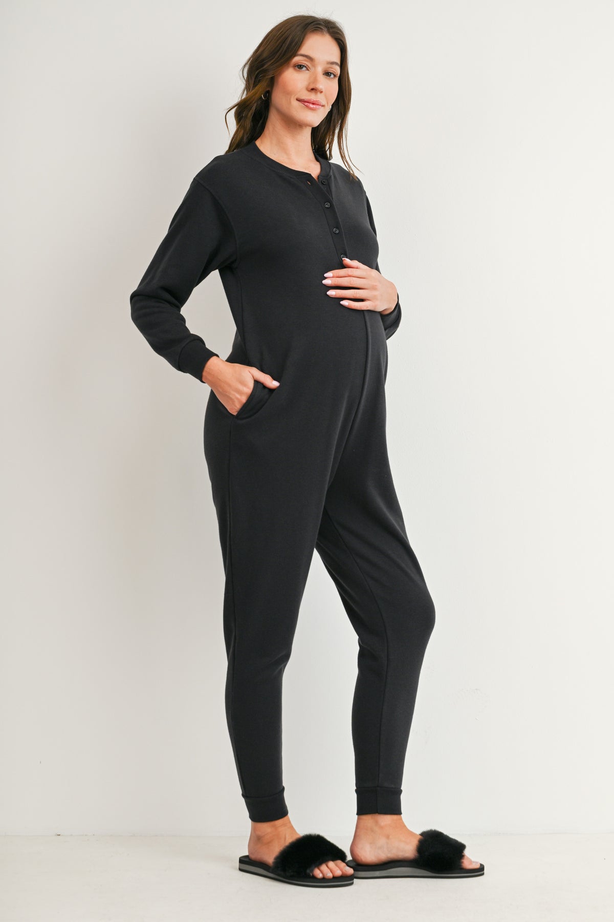 Black maternity nursing jogger jumpsuit with button-front access and pockets