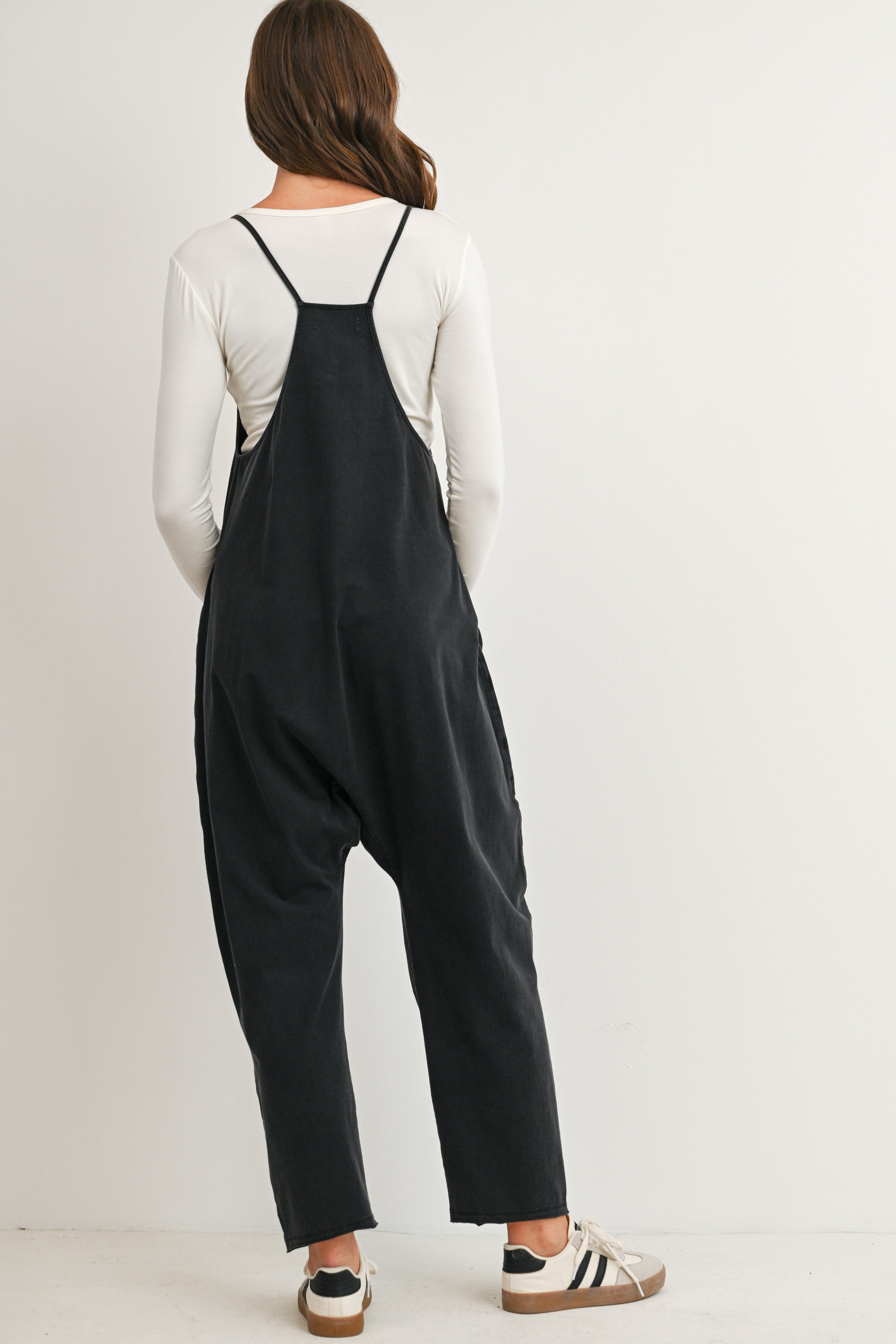 Black maternity overall jumpsuit with pockets and relaxed fit back view
