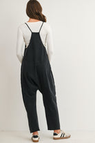 Black maternity overall jumpsuit with pockets and relaxed fit back view