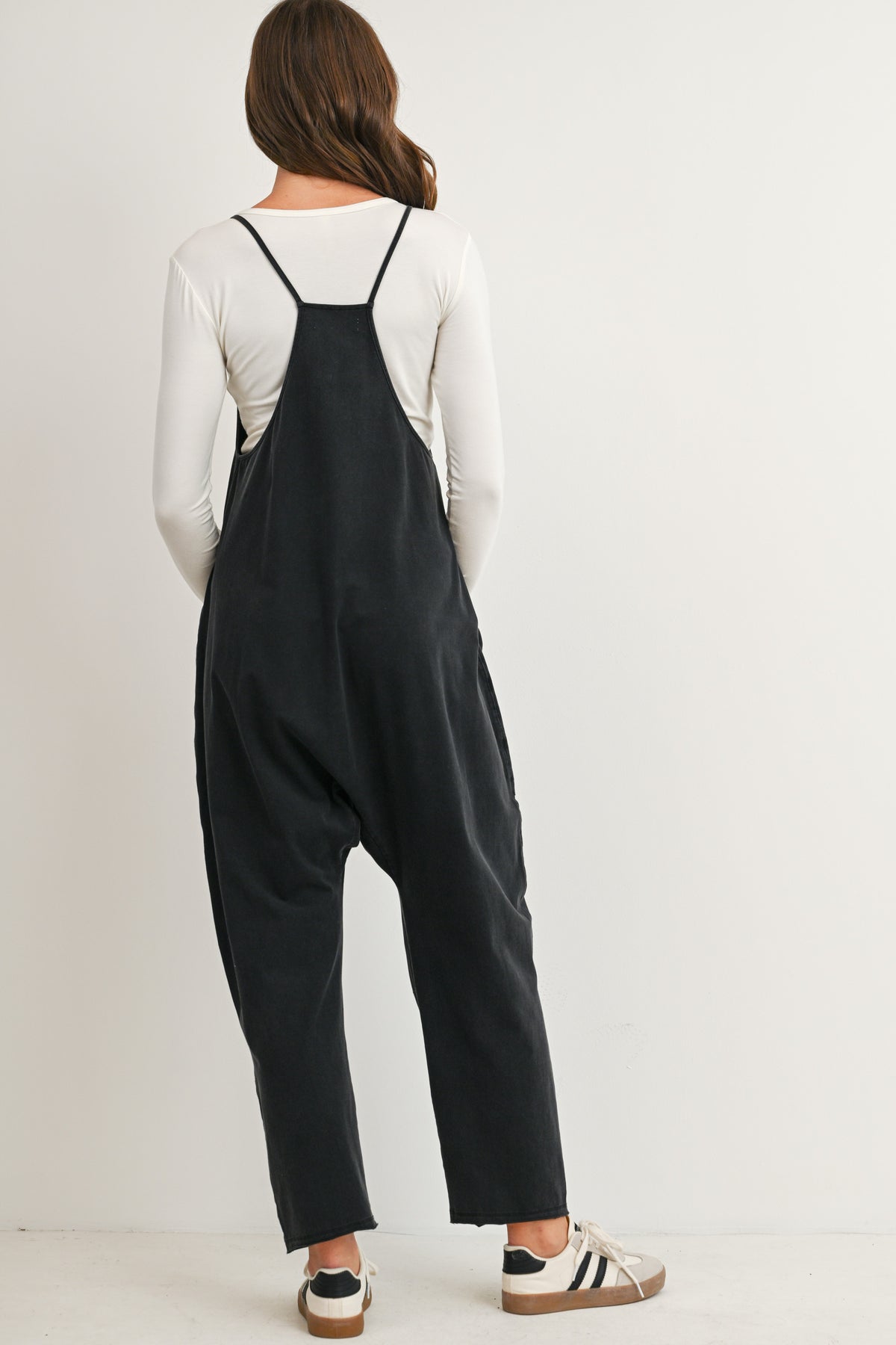 Black maternity overall jumpsuit with pockets and relaxed fit back view