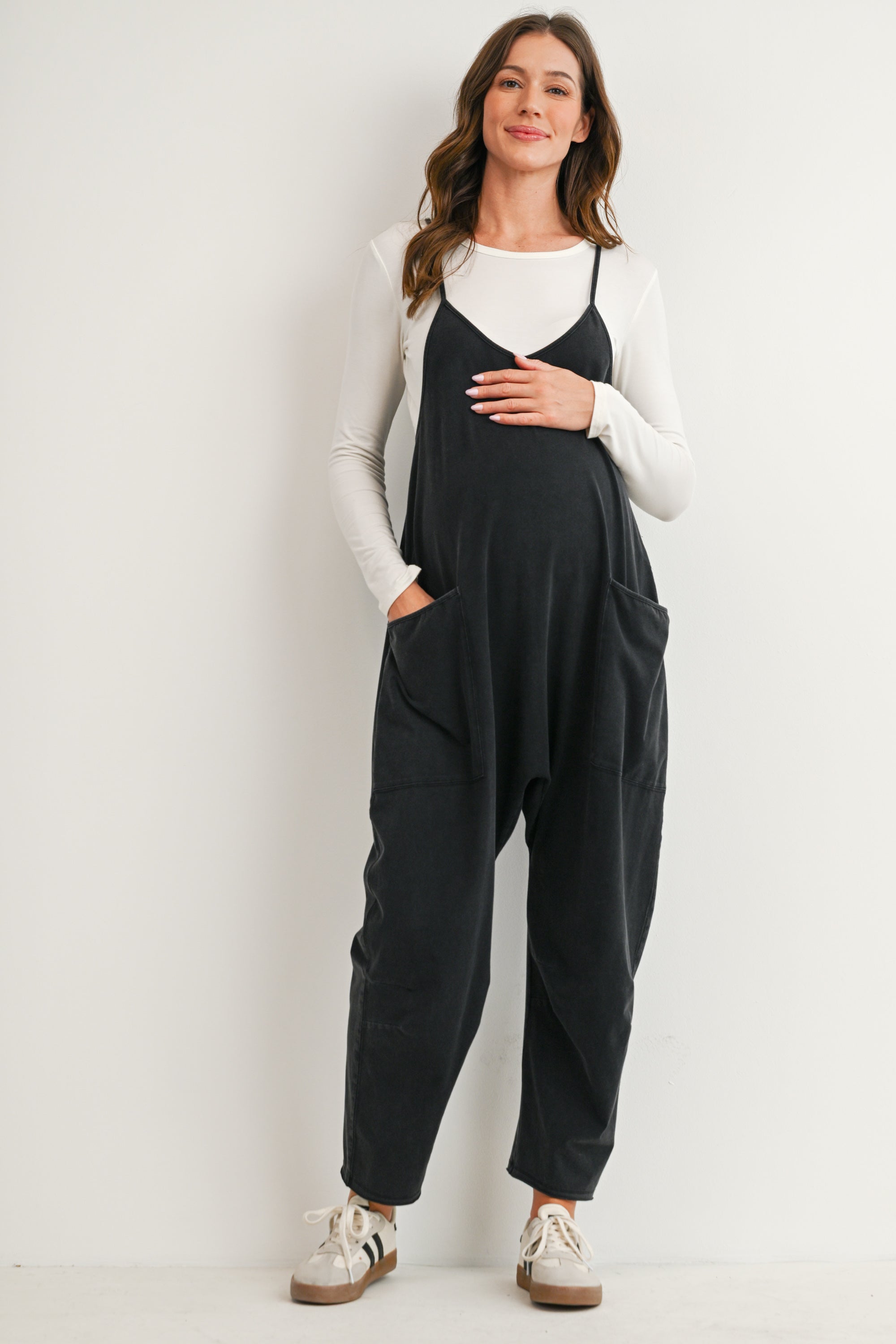 Black maternity overall jumpsuit with pockets and relaxed fit front view