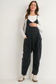Black maternity overall jumpsuit with pockets and relaxed fit front view