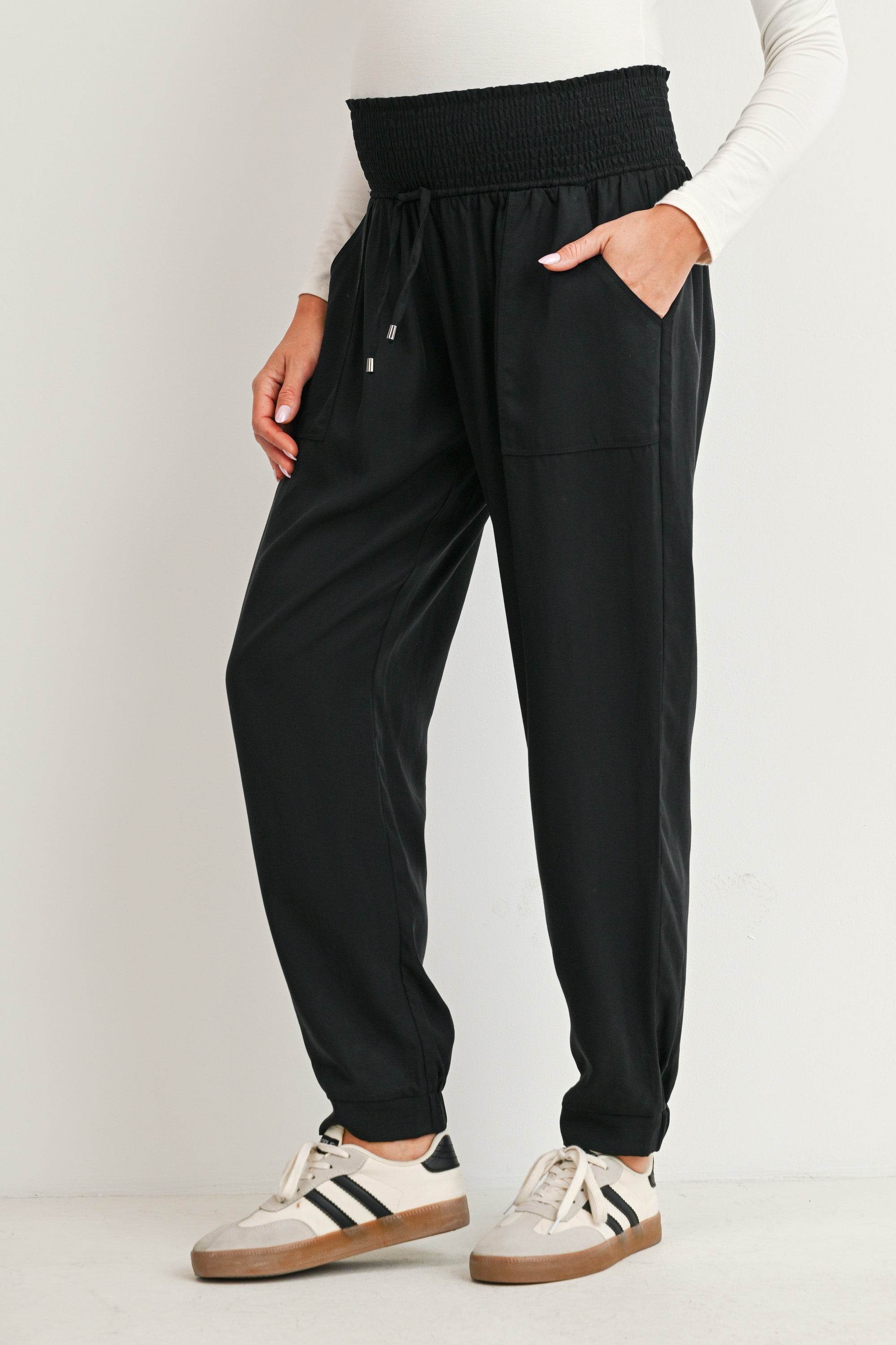 Black maternity high rise jogger pants with drawstring waist and patch pockets