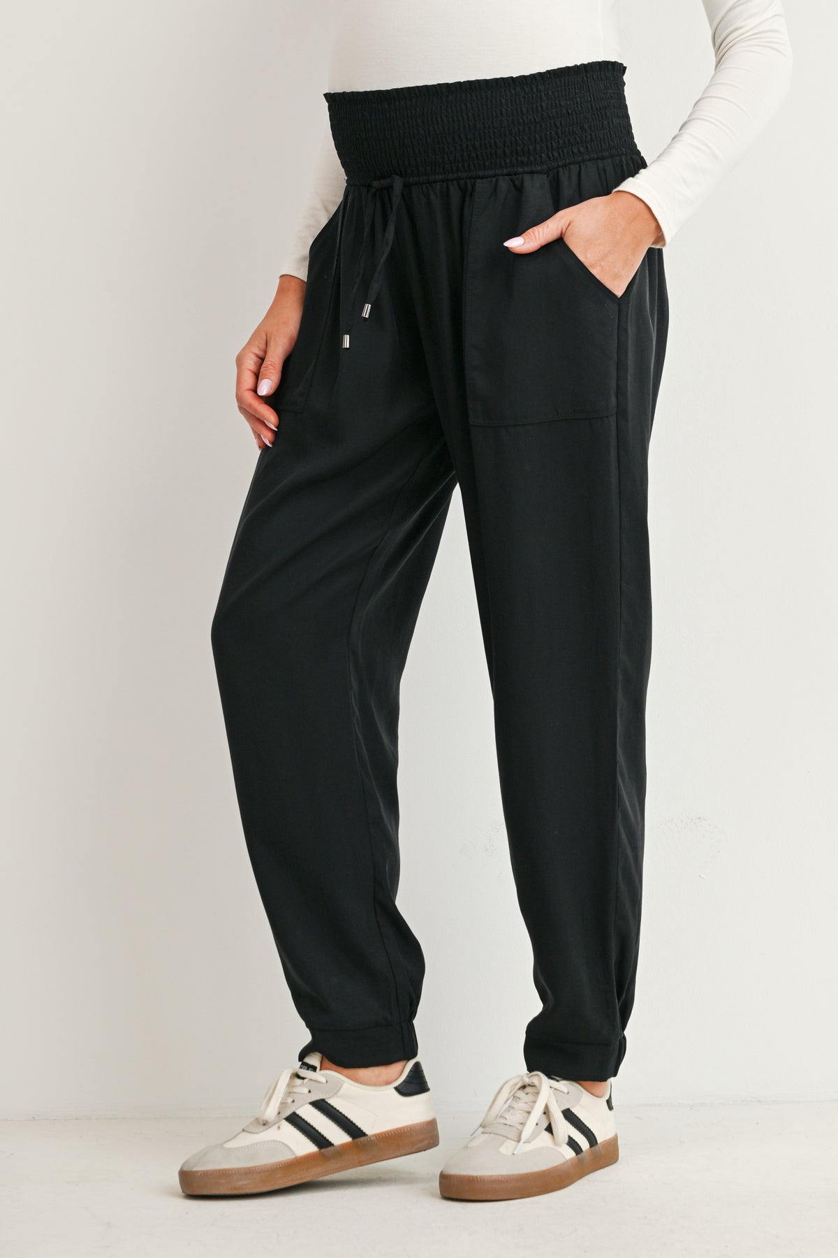 Black maternity high rise jogger pants with drawstring waist and patch pockets