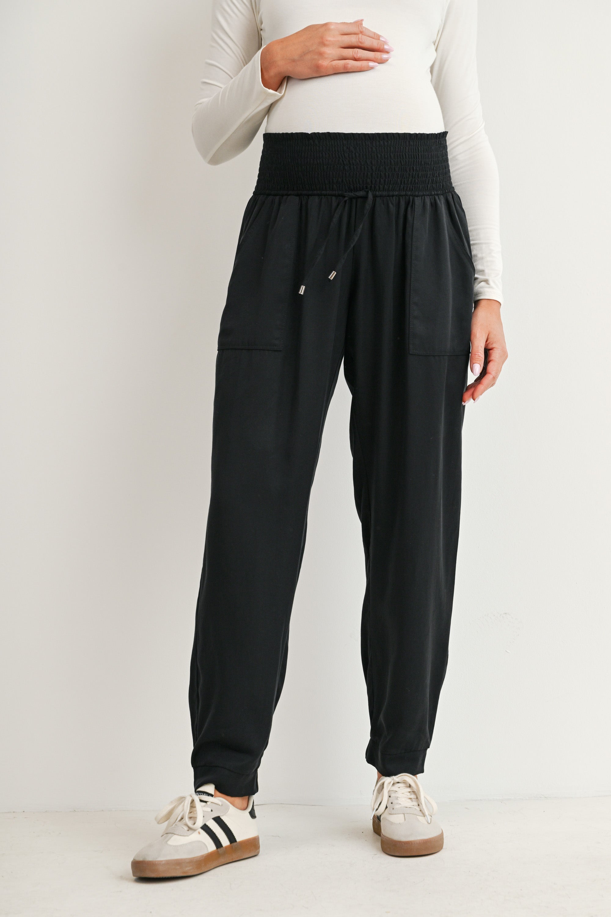 Black maternity jogger pants with smocked waistband and front pockets