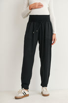 Black maternity jogger pants with smocked waistband and front pockets