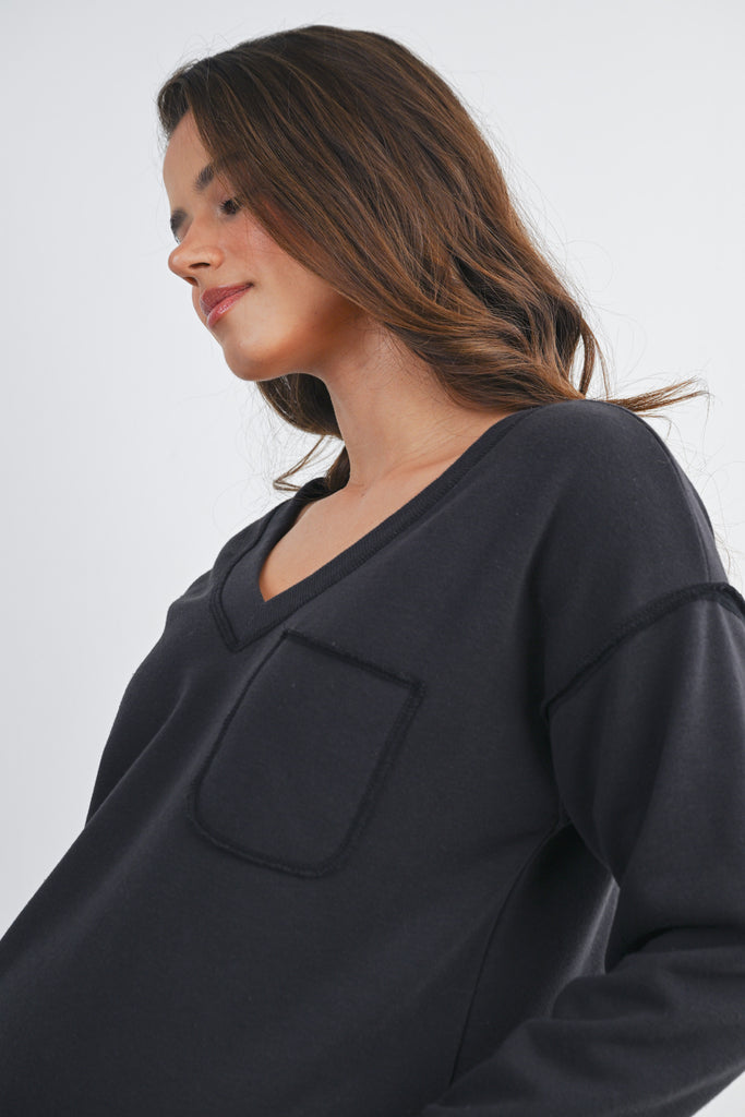 Black V Neck Long Sleeve Front Pocket Maternity Pullover Top Front View Pocket Detail