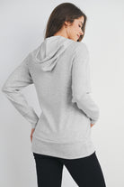 Back view of heather grey maternity nursing hoodie showing hood