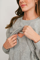 Heather gray maternity sweatshirt with discreet lift-up breastfeeding access