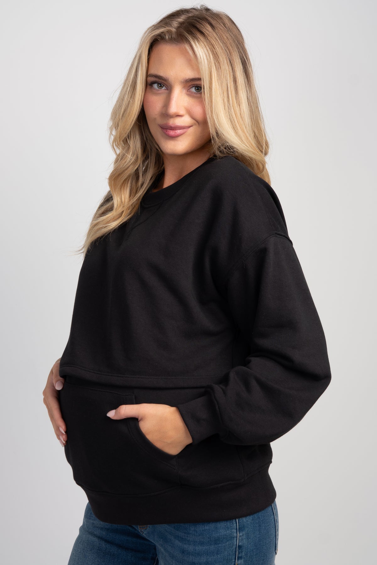 Side view of Black maternity nursing sweatshirt with kangaroo pocket
