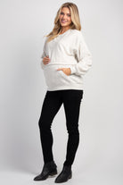 Full body view of Hello Miz maternity nursing sweatshirt in oatmeal with kangaroo pocket