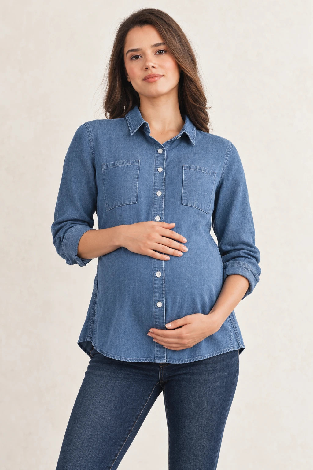 Maternity model in the CMT7004 denim shirt, gently holding her baby bump